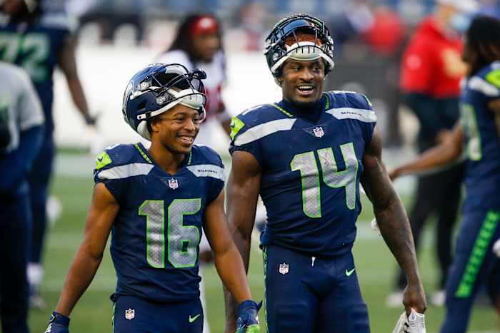 Nov 1, 2020; Seattle, Washington, USA; Seattle Seahawks wide receiver Tyler Lockett (16) and wide receiver DK Metcalf (14) return to the locker room following a 37-27 victory against the San Francisco 49ers at CenturyLink Field. Mandatory Credit: Joe Nicholson-USA TODAY Sports